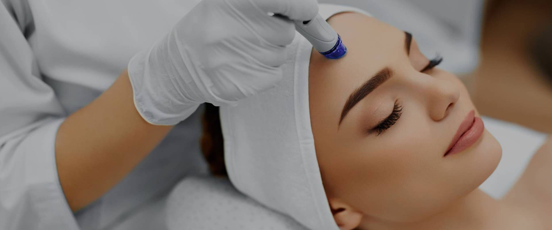 Surgeon performing a skin procedure in a modern clinic