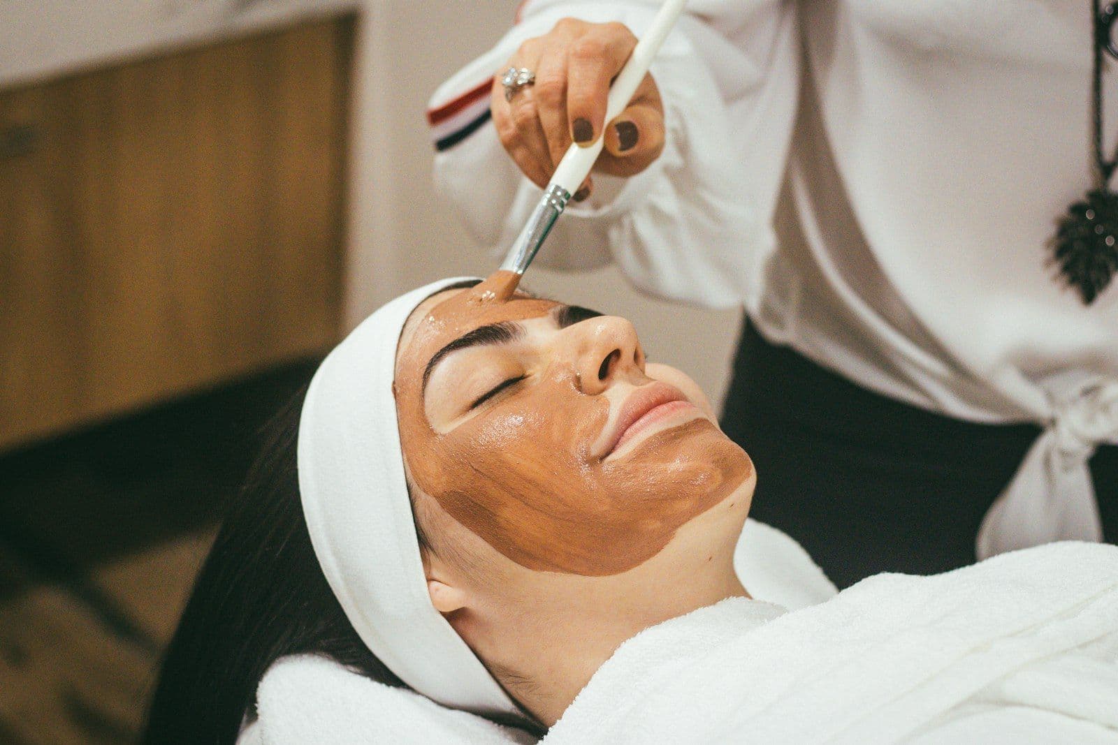 Patient receiving a precision facial aesthetic treatment